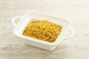 Raw bulgur in the bowl