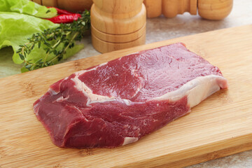 Raw rib-eye beef steak black angus