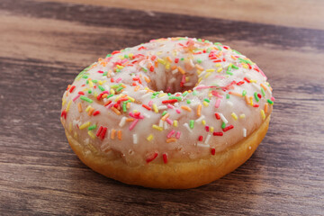 Sweet glazed vanilla donut with icing