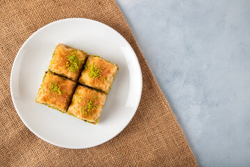 Pistachio baklava on a white plate.
