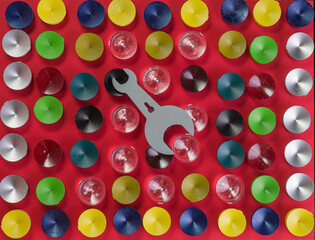 The chips are round in shape and different colors on a red background, the upper angle.