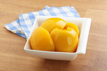 Sweet canned peaches with syrope