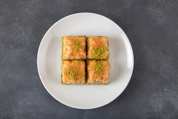 Traditional Pistachio baklava on a white plate
