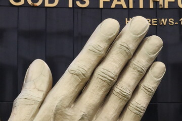  close view of hand of a person with gold color 
