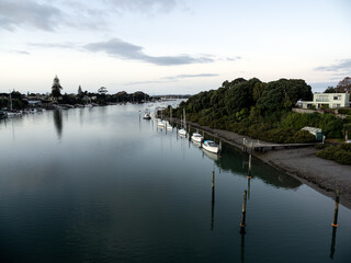 Aerial view of Tamaki river (Auckland, New Zealand) with moored boats. Stock photo.