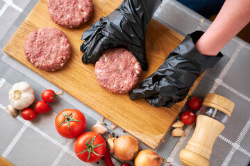 Making Billets for burgers from fresh minced meat on domestic kitchen