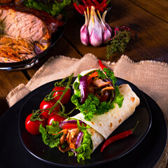 tasty pulled pork wrap with vegetables.
