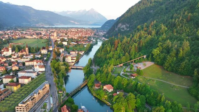 Aerial view of Interlaken and Thunersee in Switzerland, flying above the town of Interlaken in Switzerland in the morning, Swiss mature and tourism concept