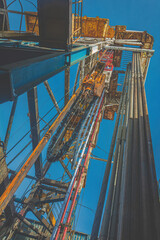 View of a drilling rig for drilling wells in an oil and gas field near, from bottom to top