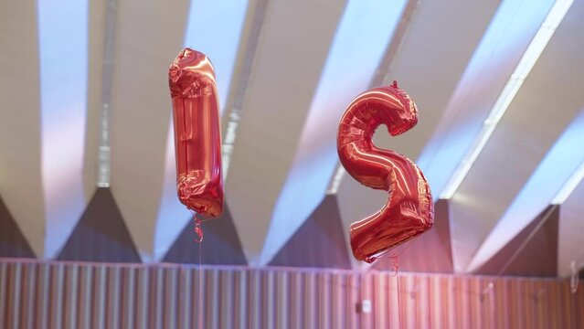 Balloon helium numbers flying in the air interior 4K