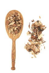 Saw palmetto herb used in natural herbal plant medicine to treat impotence, low libido, prostrate problems, toothache, muscle waste,  fatigue. In a wooden spoon and loose on white background.