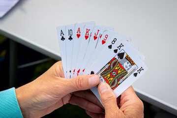 A handful of playing cards, to play the favorite game of belote, with four people, photo taken in the Netherlands