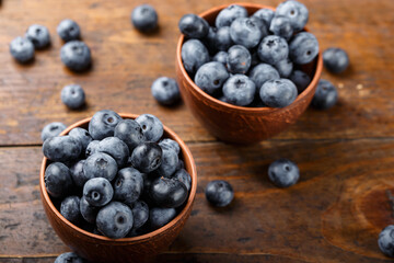 Freshly picked blueberries in a clay bowl. Healthy berry, organic food, antioxidant, vitamin