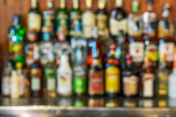 Metal table with alcohol bar background.