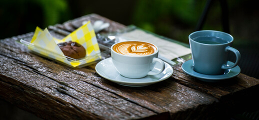 afternoon coffee break. Latte cup with chocolate cookie.
