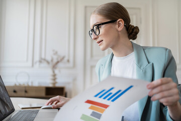 Female financier with glasses workplace in the office
