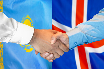 Handshake on Kazakhstan and Iceland flag background. Support concept