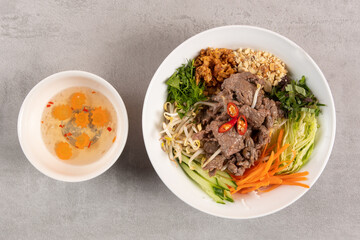 Bun Bo Hue, Bun Bo, Vietnamese beef noodle soup spicy. bowl of beef and rice vermicelli soup,...