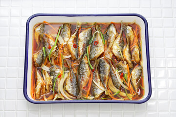 small fish escabeche ( deep fried horse mackerel marinated in spicy vinegar sauce )