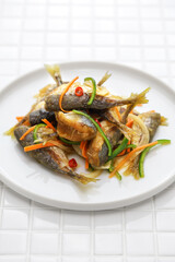 small fish escabeche ( deep fried horse mackerel marinated in spicy vinegar sauce )