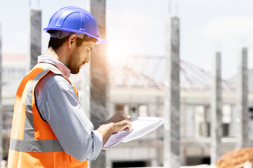 A man is working happily to build a house site plan.