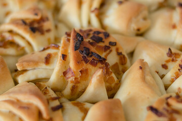 Fresh yeast pie with fried onions. In a white brazier close-up
