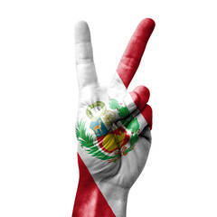 Hand making the V victory sign with flag of peru