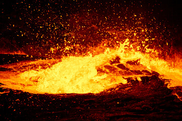 Erta Ale lava lake after sunset with black undulating and exploding lava, Danakil, Afar Region,...