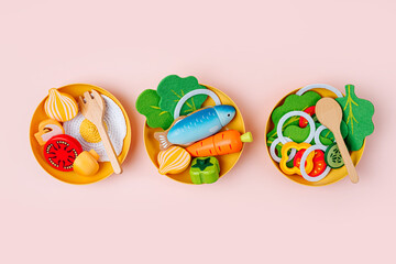 Plates with breakfast, lunch and dinner. Wooden fruit and vegetables play set.  Game for learning...
