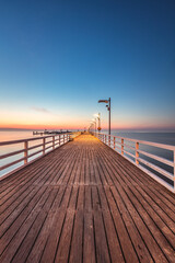 Sunrise over the pier in Mecheliki