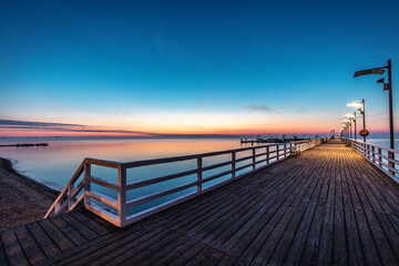 Sunrise over the pier in Mecheliki