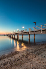 Fototapeta premium Sunrise over the pier in Mecheliki