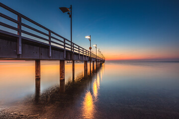 Obraz premium Sunrise over the pier in Mecheliki