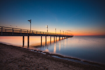 Fototapeta na wymiar Sunrise over the pier in Mecheliki