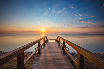 Sunrise over the pier in Mechelinki - 508779290