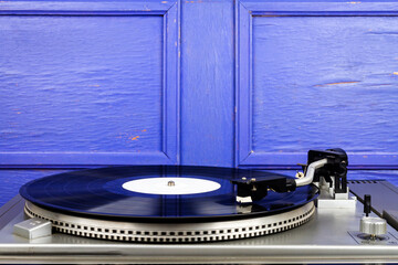 Close up of turntable needle on a vinyl