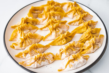 uncooked healthy plant-based food, homemade wonton dumplings with lentil carrot and onion filling