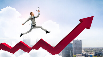 Obraz premium Portrait of energetic businessman jumping in open air