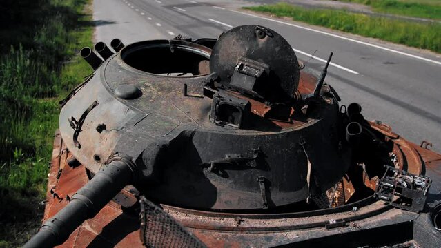 Burnt and destroyed Russian military equipment on a roadside in Ukraine. Attack of the Russian invaders. Infantry fighting vehicle (IFV). Destroyed military equipment. Russian aggression in Ukraine.