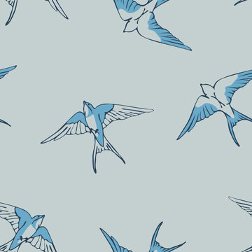 Seamless vector pattern with swallow bird doodle on grey background. Simple flock of bird wallpaper design. Decorative blue bird fashion textile.