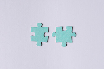 Blue two match puzzle pieces on white background