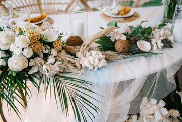 Wooden tables for wedding dinner decorated with tropical flowers, pineapples, coconuts and glass lamps. Concept of a tropical destination wedding.
Photo Formats
3760 × 5651 pixels • 12,5 × 18,8 in • D