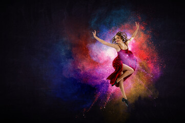 Fototapeta na wymiar Female dancer against abstract colourful background