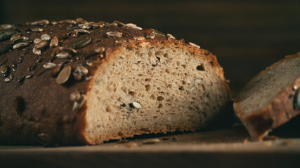 Close-up of homemade whole grain bread crumb with seeds. Selective focus