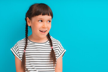 Portrait of happy excited amazed open mouth kid child girl brunette striped dress look in copyspace