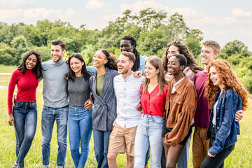 large group of people of Generation Z, young university students have fun outdoor in a city park