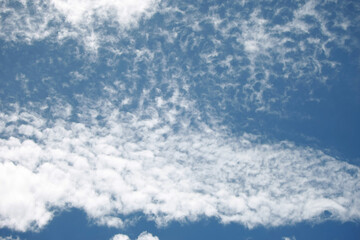 Naklejka na ściany i meble Clouds on the blue sky nature with space background wallpaper