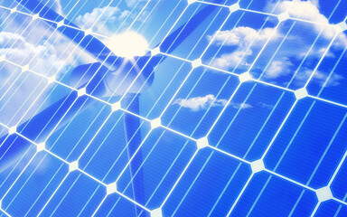 Solar panel with reflection of wind turbine and bright blue sky and cloud. Green energy or...