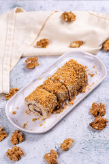 Palace halva. Traditional Turkish cuisine delicacies. Chocolate halva dessert on stone background. Close-up. local name saray helvasi