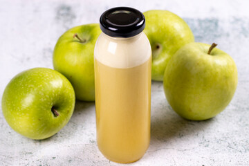 Apple juice. Freshly squeezed juice. Freshly squeezed apple juice in glass on stone background. Close-up